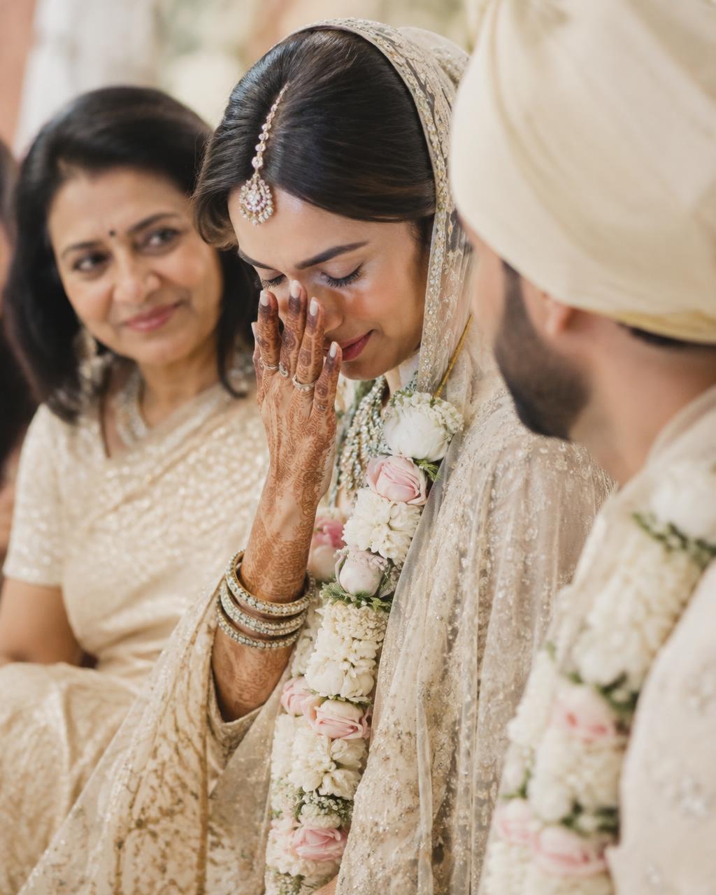 Traditional Indian wedding ceremony illuminated in ceremonial gold light